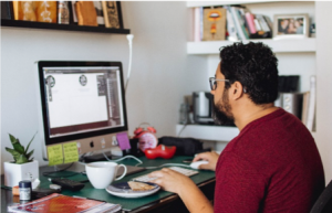 man working in his office on his computer