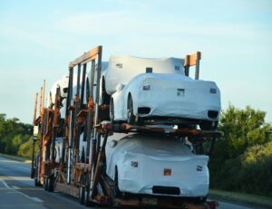 A truck with a bunch of cars on the back of it