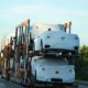 A truck with a bunch of cars on the back of it